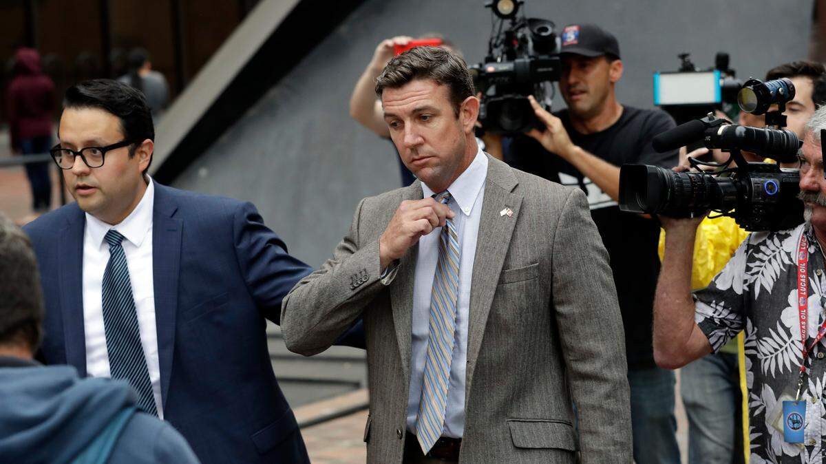 U.S. Rep. Duncan Hunter (R-Alpine), center, leaves court Monday, Sept. 24, 2018, in San Diego. 