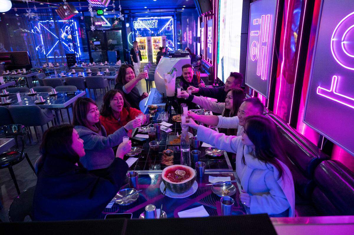 A group of friends and colleagues from Connie Van Real Estate Group dine at Z Town Asian Gastro Bar in Elk Grove in January.