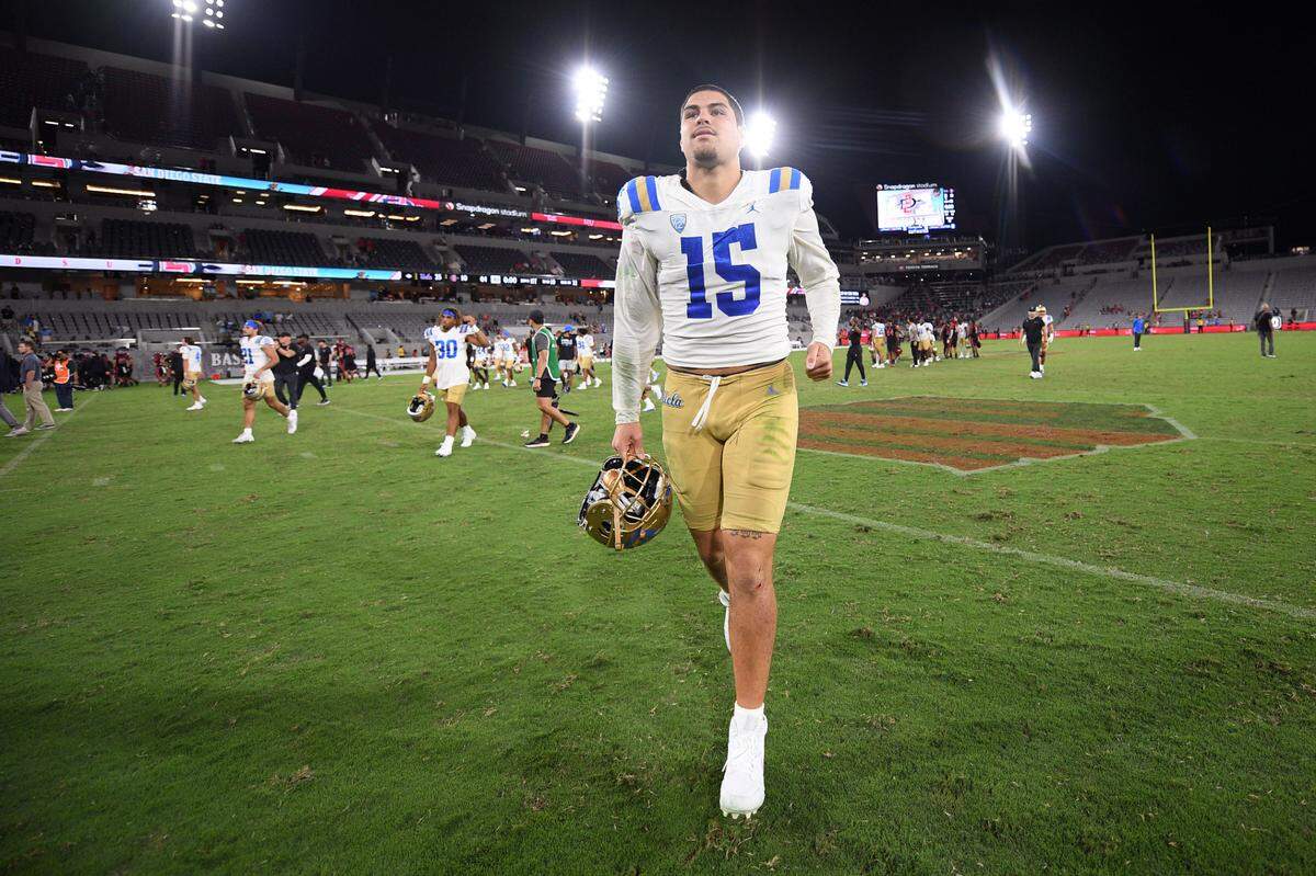 UCLA Bruins defensive lineman Laiatu Latu (15) runs off the field after the game against the San Diego State Aztecs on Sept. 9, 2023, at Snapdragon Stadium in San Diego.