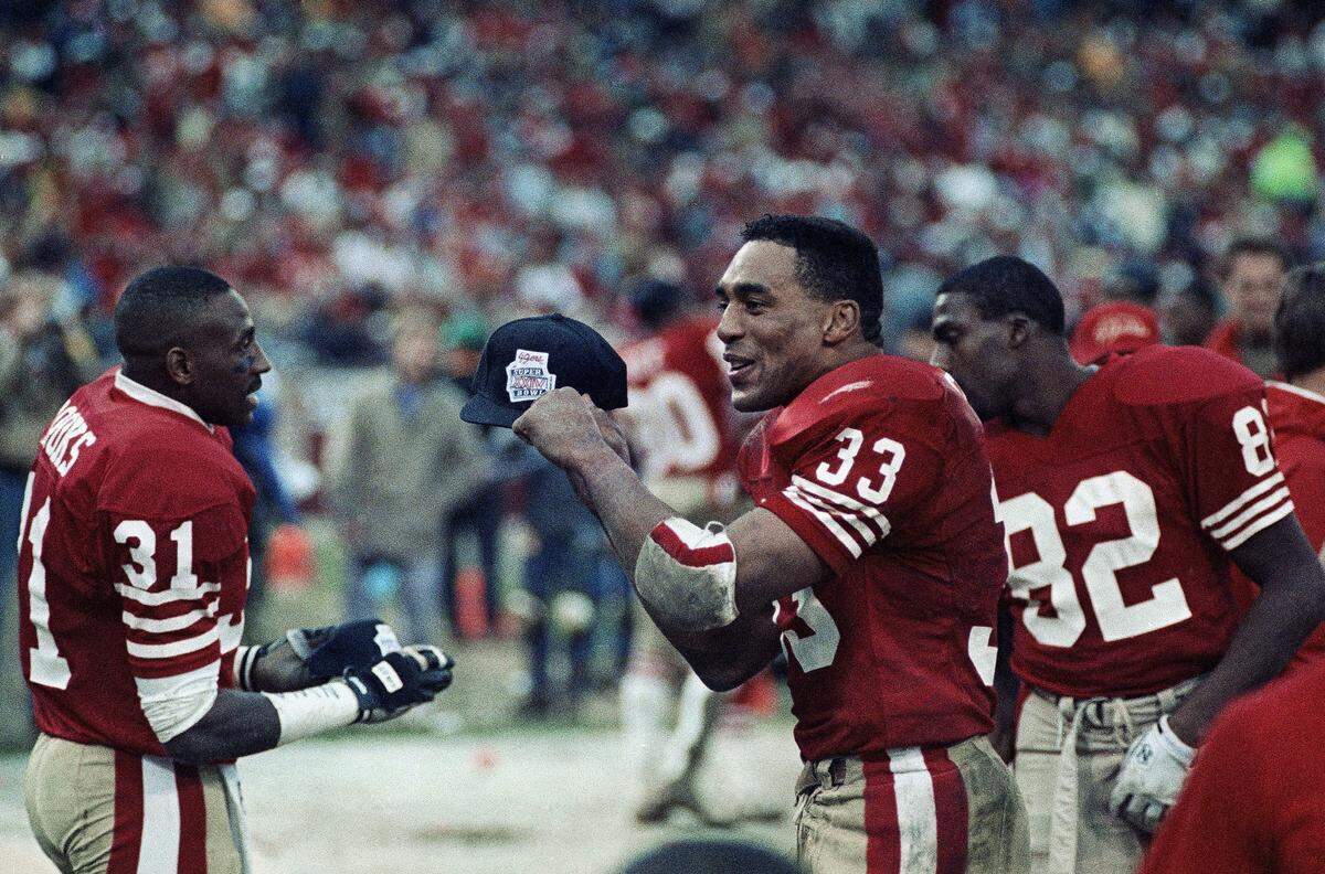 San Francisco 49ers running back Roger Craig shows off a Super Bowl cap in the fourth quarter as his team heads for a 30-3 win over the Los Angeles Rams at Candlestick Park in San Francisco on Jan. 15, 1990. It’s the only time the two teams have met previously in the NFC Championship.