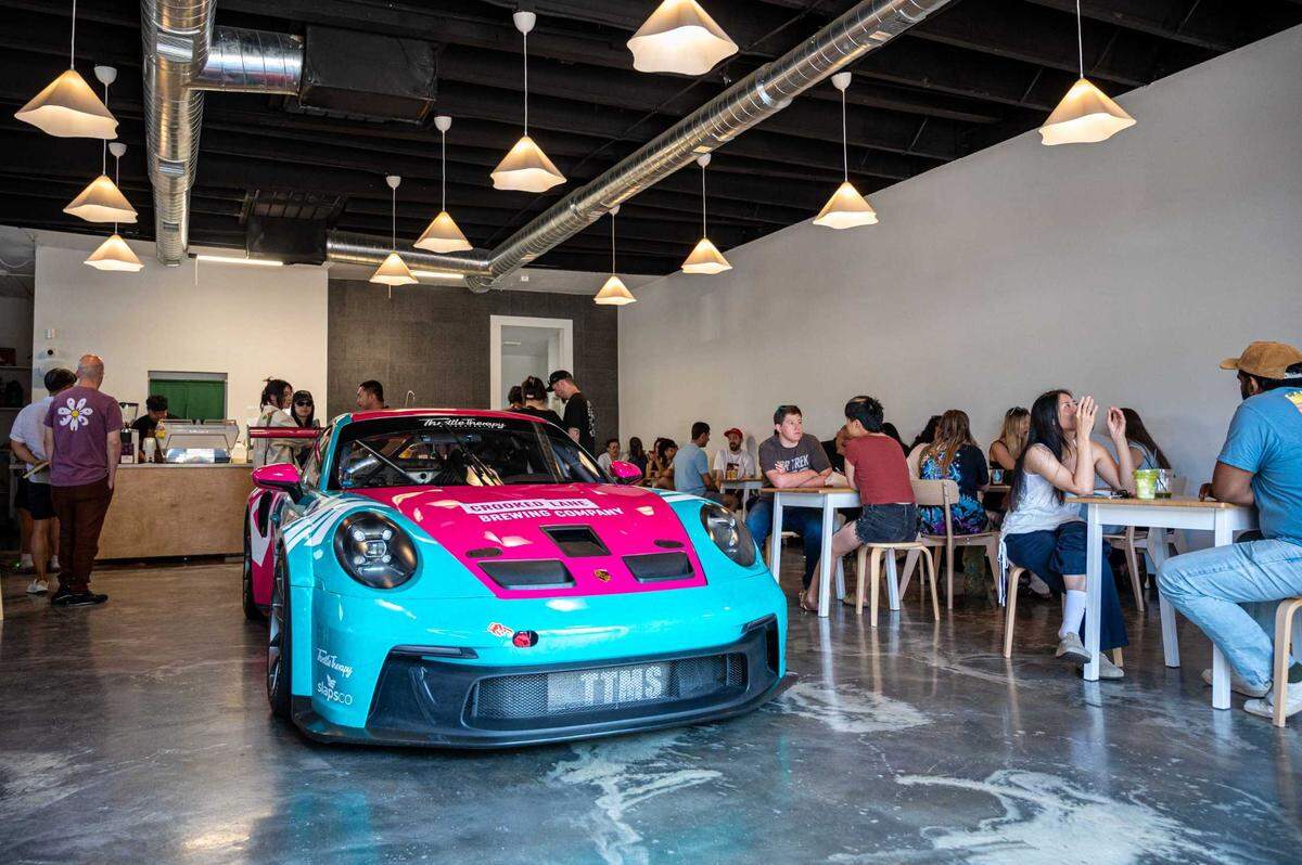 A Porsche GT3 Cup car is on display at Chloe Ca Phe in midtown on Saturday, July 12, 2025.