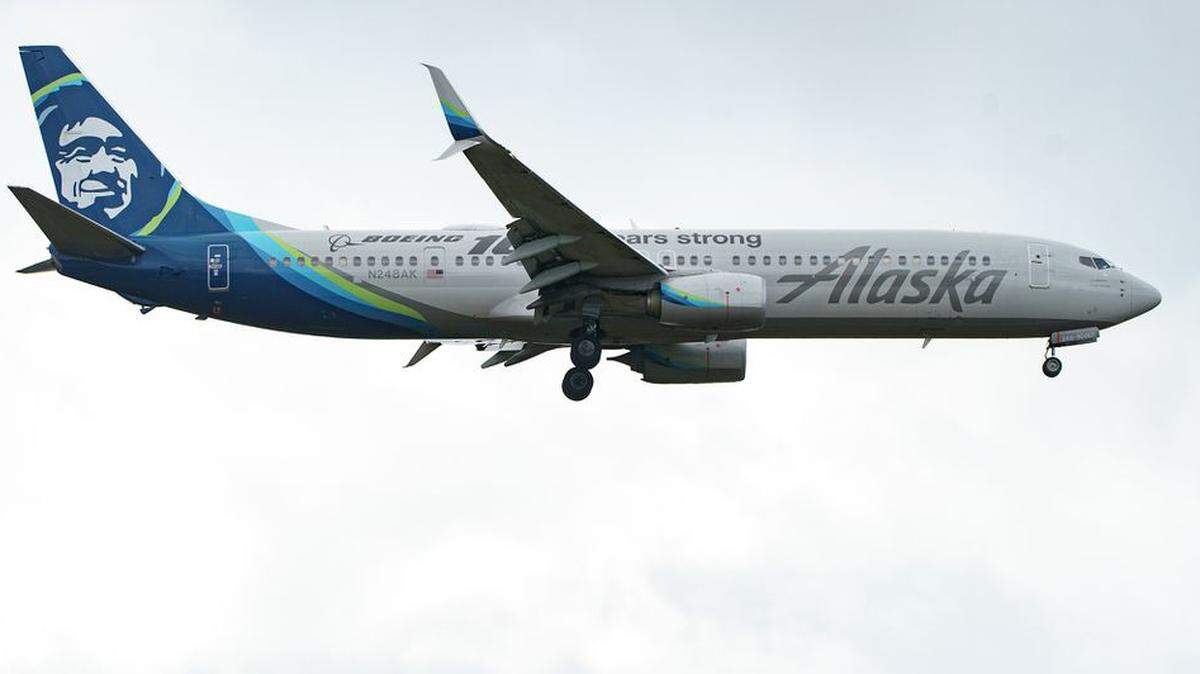 An Alaskan Airlines plane lands at Portland International Airport in March.