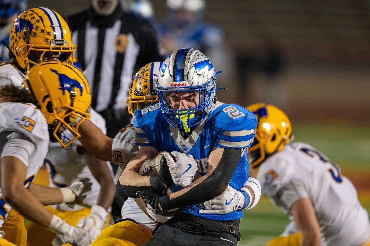 Rocklin Thunder running back Rafi Merino (2) gains a few yards in the first half against the Grant Pacers in the Sac-Joaquin Section Division II championship on Friday at Hughes Stadium in Sacramento.