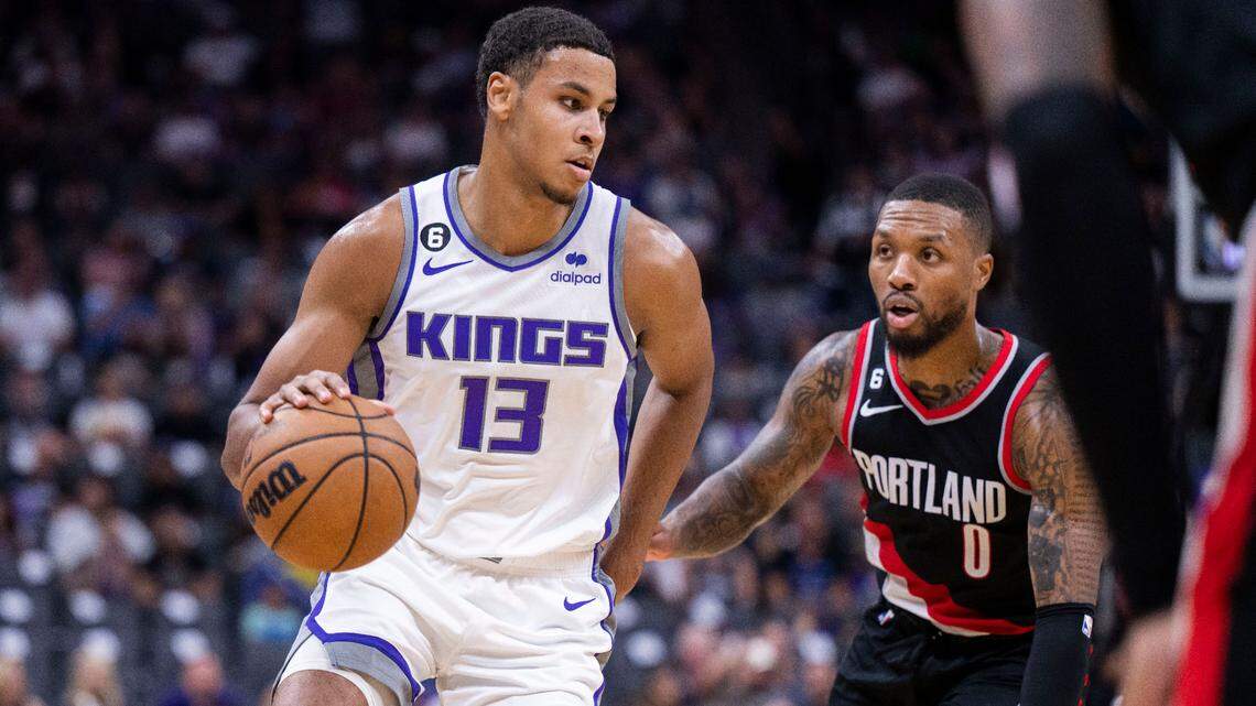Sacramento Kings forward Keegan Murray (13) drives to the basket against Portland Trail Blazers guard Damian Lillard (0) on Sunday, Oct. 9, 2022 during an exhibition NBA basketball game at Golden 1 Center in Sacramento.