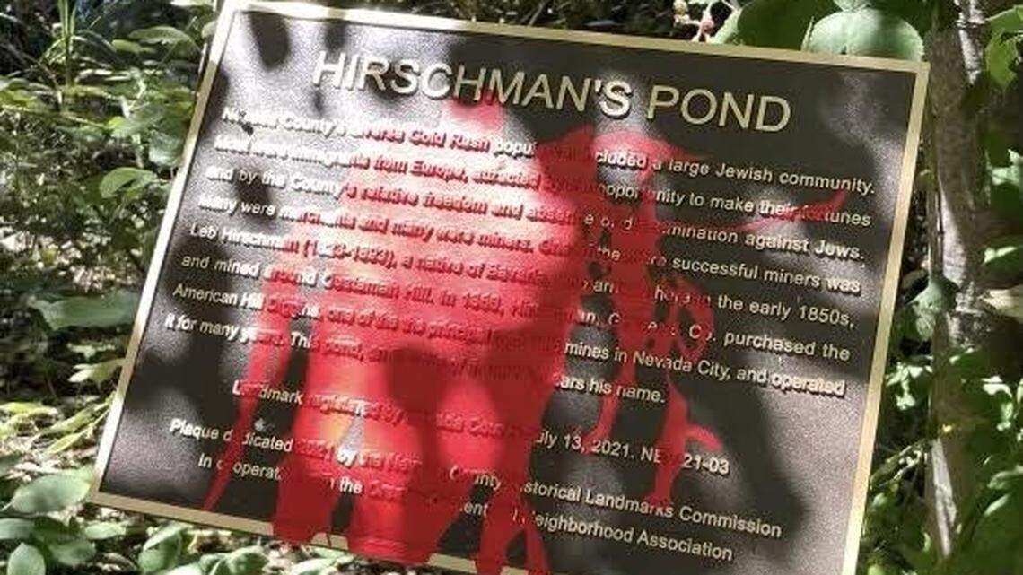 A vandalized plaque honoring the Jewish community in Nevada County at Hirschman’s Pond. A hiker reported red paint poured on the plaque on Friday.