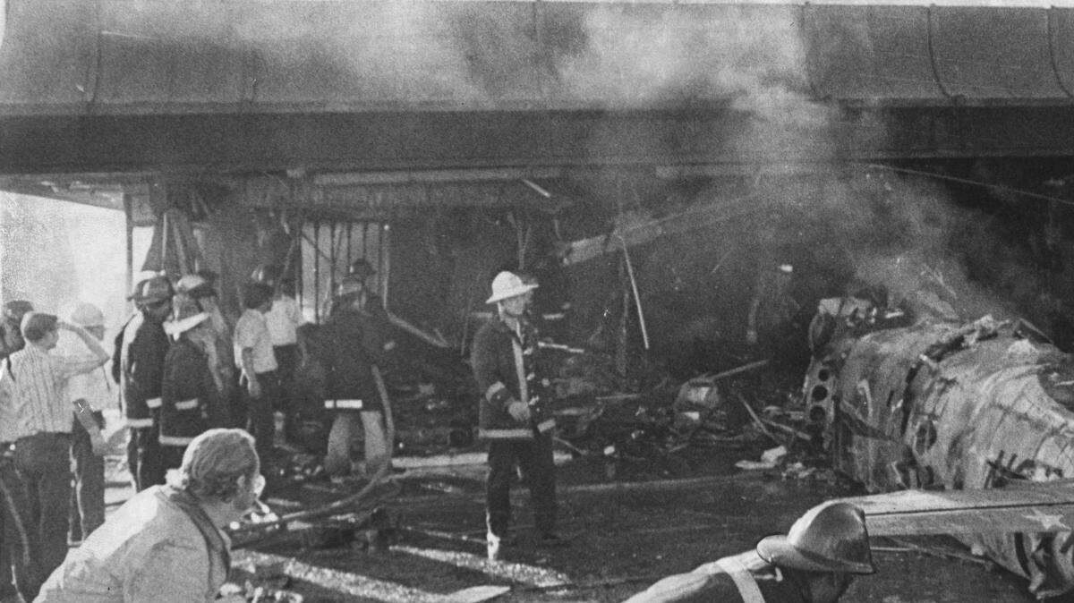 Firefighters move hoses and survey the scene at  Farrell's Ice Cream Parlor in Sacramento after an F-86 jet crashed into the building on September 24, 1972 .

Twenty-two people died when the old war jet failed to take off from runway 12-30 at Executive Aiport during an air show and crashed into Farrell's Ice Cream Parlor at 4:25 p.m. Twelve of the victims were children. Nine members of one family died. Two victims were a husband and wife in their car on Freeport Boulevard when the car ricocheted off the berm next to Freeport Boulevard. A 23rd person was hit and killed by a car minutes later as she ran toward the ice cream parlor, thinking wrongly that her grandchildren were inside. Farrell's never reopened.  Sacramento Bee photograph by Leo Neibaur.

Without Words - 2007 Crocker Exhibition