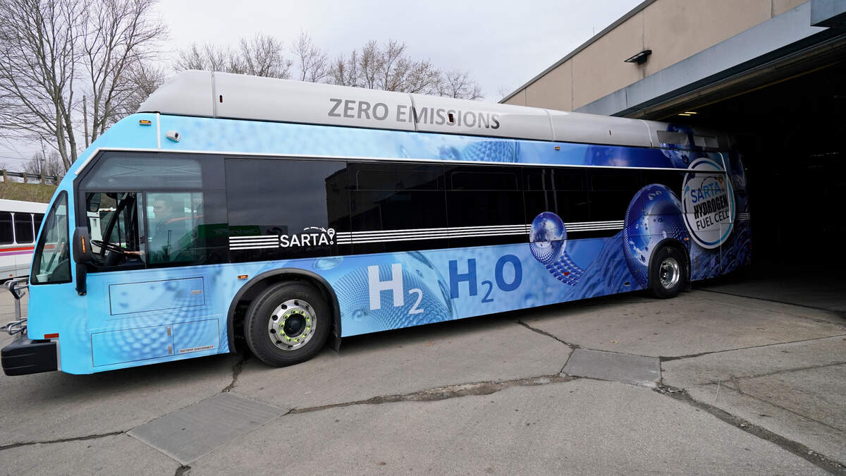 Kevin Baker, a maintenance technician, drives a hydrogen fuel cell bus out of the terminal, Tuesday, March 16, 2021, in Canton, Ohio. Hydrogen, the most abundant element in the universe, is increasingly viewed as a vital answer to troubling questions about how to slow the catastrophic effects of climate change attributed to the planet’s 1.2 billion cars and trucks, nearly all of which burn gasoline and diesel.