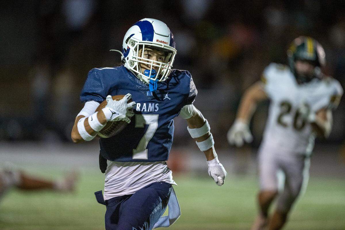 The Casa Roble Rams' Jaylan Barcenas (7) runs for a touchdown against the Placer Hillmen in Orangevale in August. 