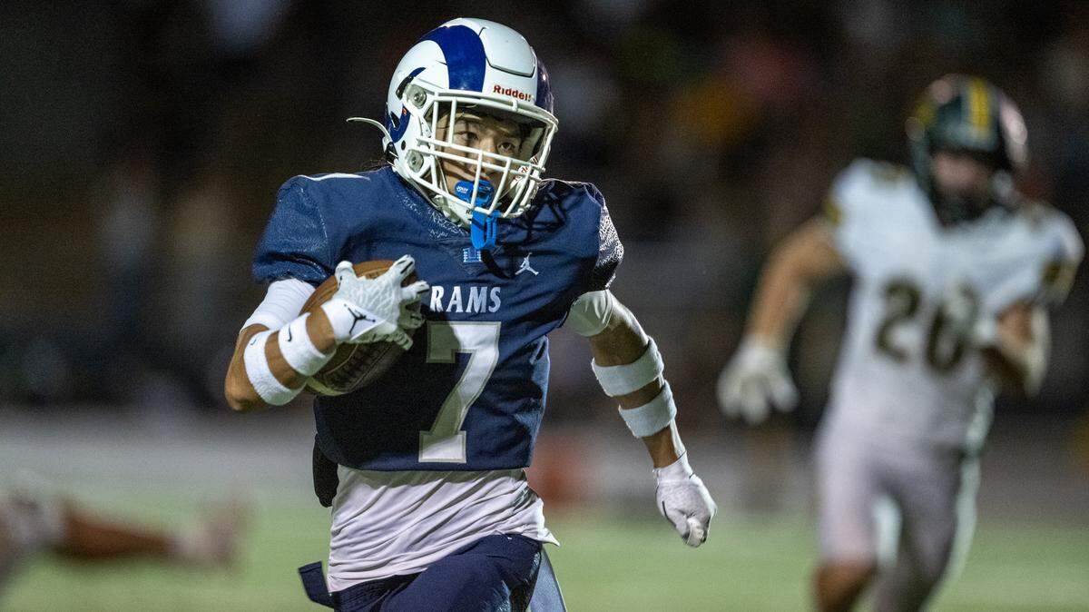 The Casa Roble Rams' Jaylan Barcenas (7) runs in for a touchdown in the first quarter in the first half in a game against the Placer Hillman on Friday in Orangevale.