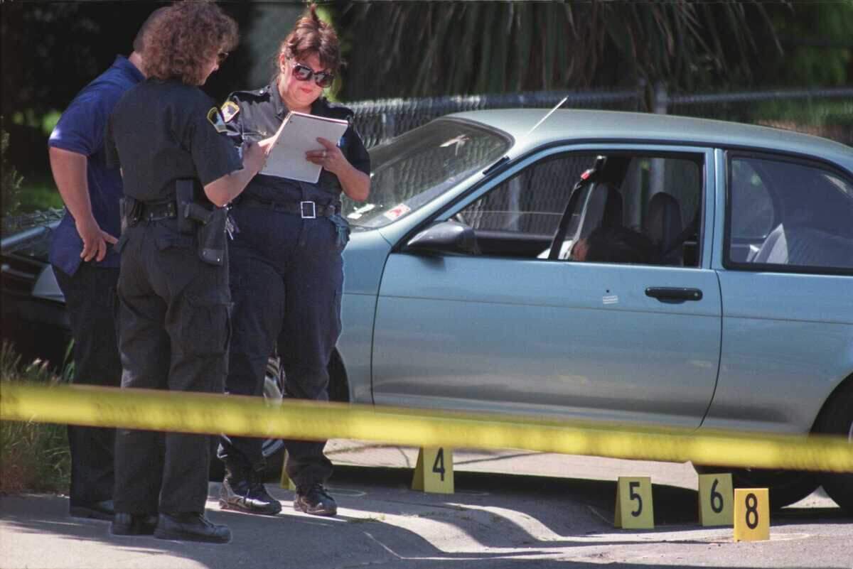 Police officers take notes in front of a vehicle driven by Elizabeth McBride who was shot and killed by her husband Michael N. Stallworth near her home on Galbraith Street in North Highlands in 1997. Eric James Abrilâs recent escape from a Roseville hospital ended peacefully, but past Sacramento-area escapes have had more violent ends.