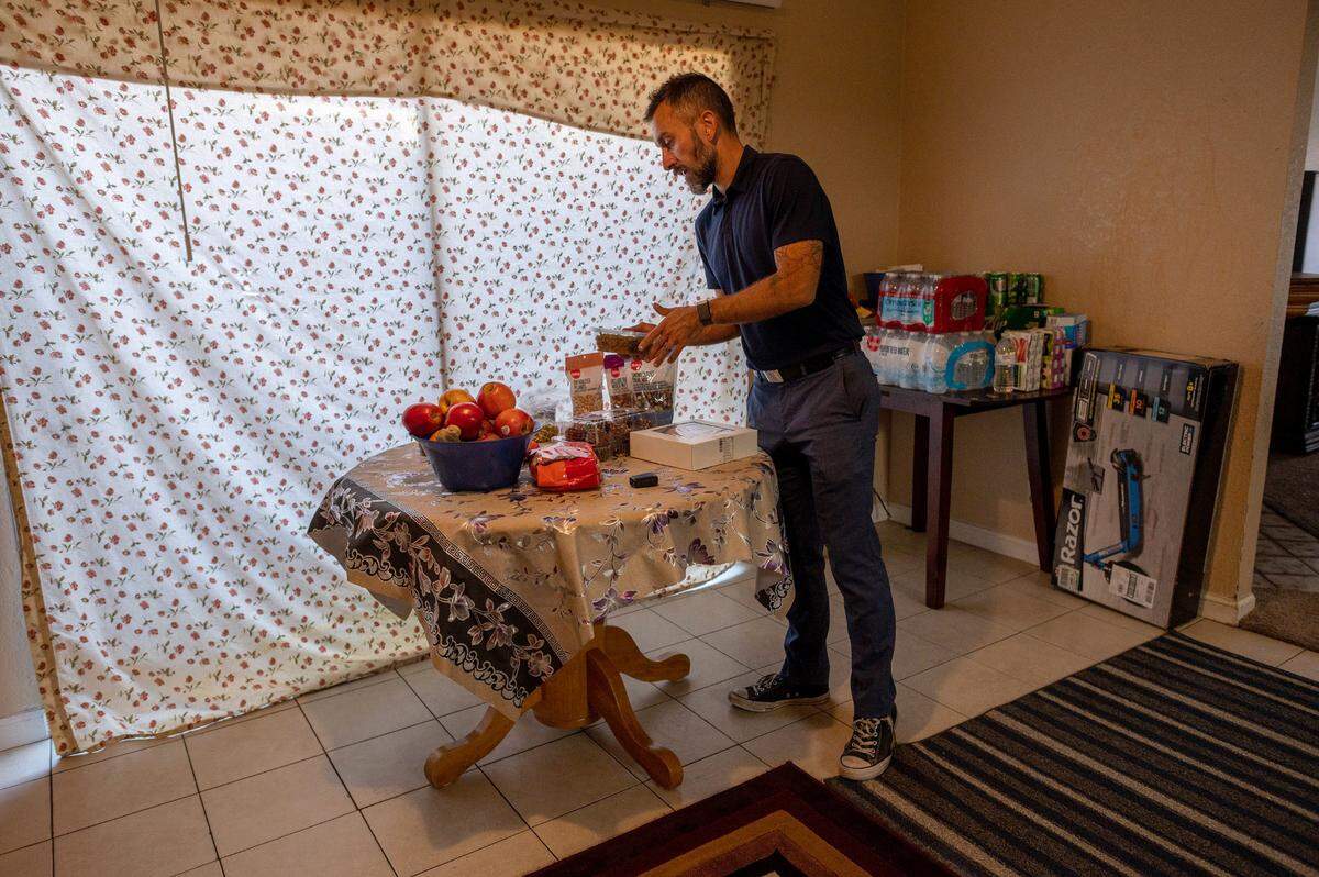 Principal Nate McGill sets out groceries, including cupcakes, for his three Afghan students on Thursday afternoon, hours before they arrived in Sacramento after a harrowing escape from Afghanistan. “I got a list from the family and they wanted cupcakes,” said McGill, who talked to them during their layover in Chicago.