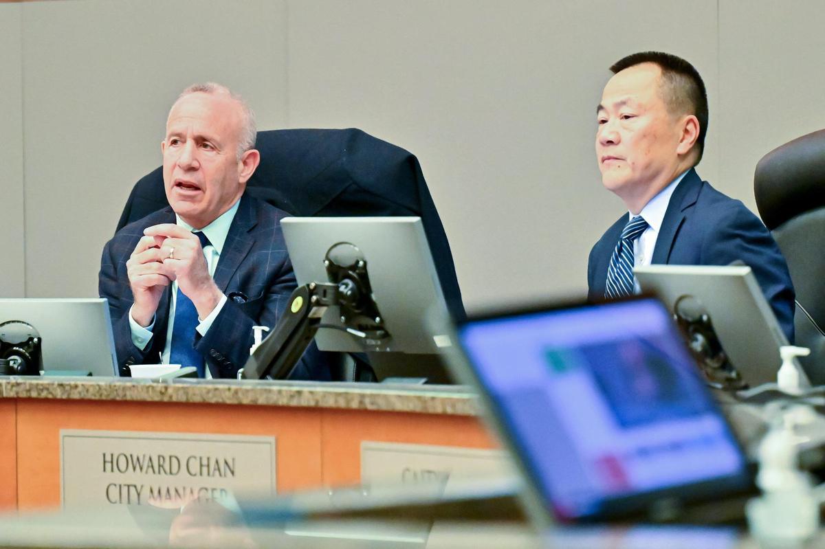 Sacramento Mayor Darrell Steinberg, left, speaks about the proposed raise for City Manager Howard Chan, right, at the City Council meeting on Jan. 9, 2024.