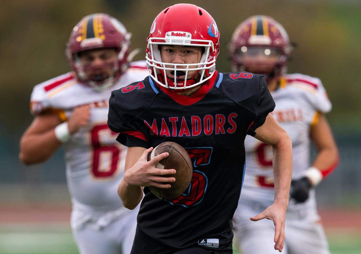 Mira Loma Matadors quarterback Deangelo Keys (6) breaks away on a keeper against the Foresthill Wildfires in the CIF Sac-Joaquin Section Division VIII championship in November. 