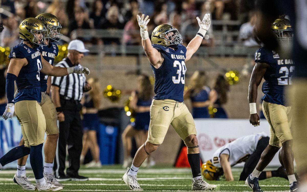 UC Davis Aggies linebacker Porter Connors (39) celebrates an interception in the second half in front of despondent Idaho Vandals quarterback Jack Wagner (10) at UC Davis Health Stadium in 2024. Connors is one of the Aggies’ returning defenders for 2025.