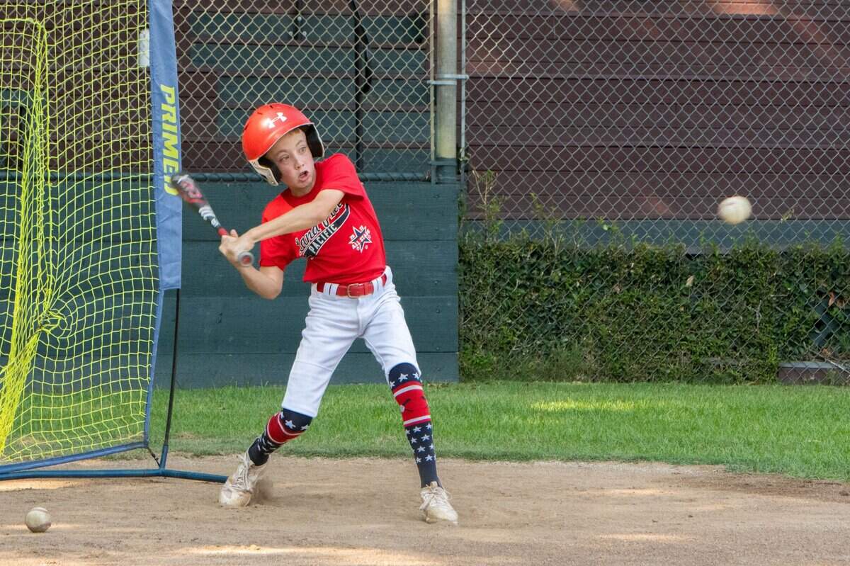 Bryce Zimmerman swings at a pitch during practice on Monday at Dooley Field in Sacramento.