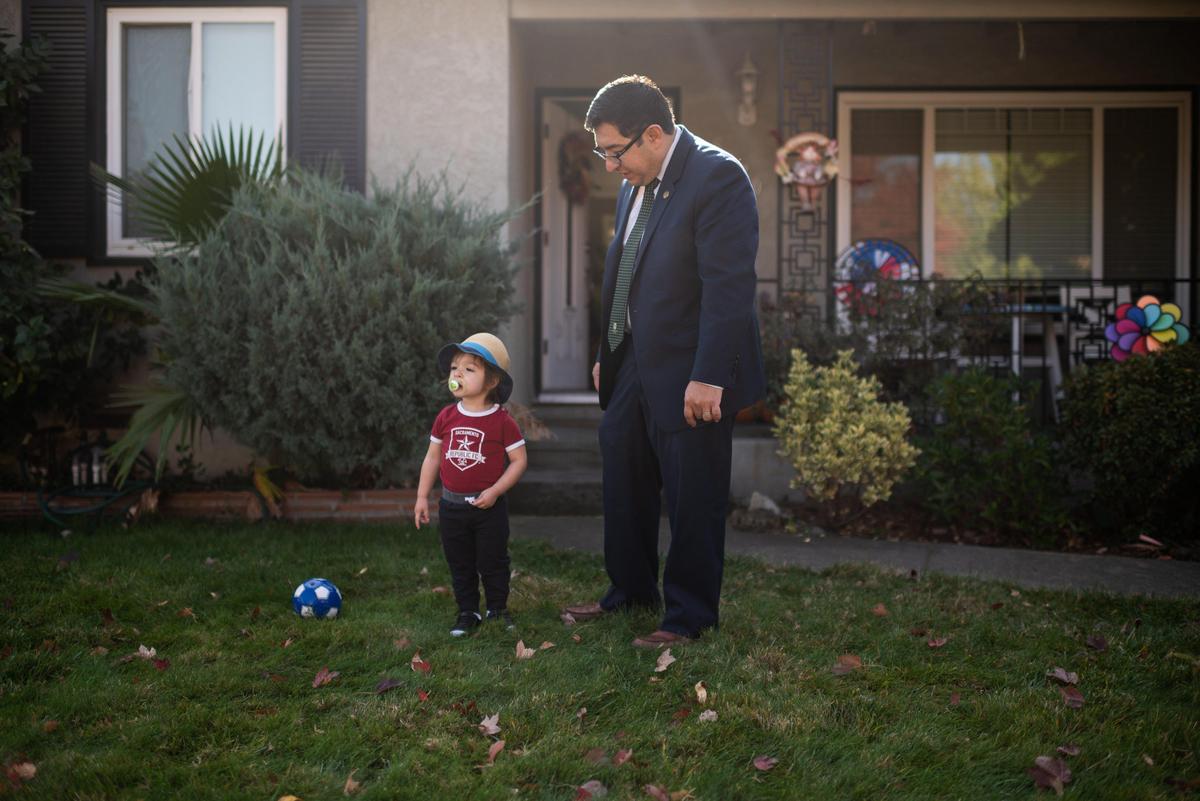 Eric Guerra spends time at home with his son, Javier, 2, who was recovering from a fever Thursday, Nov. 21, 2019, in Sacramento’s Tahoe Park neighborhood. Guerra, the City of Sacramento vice mayor, was smuggled across the border from Mexico as a child and later qualified for a green card.