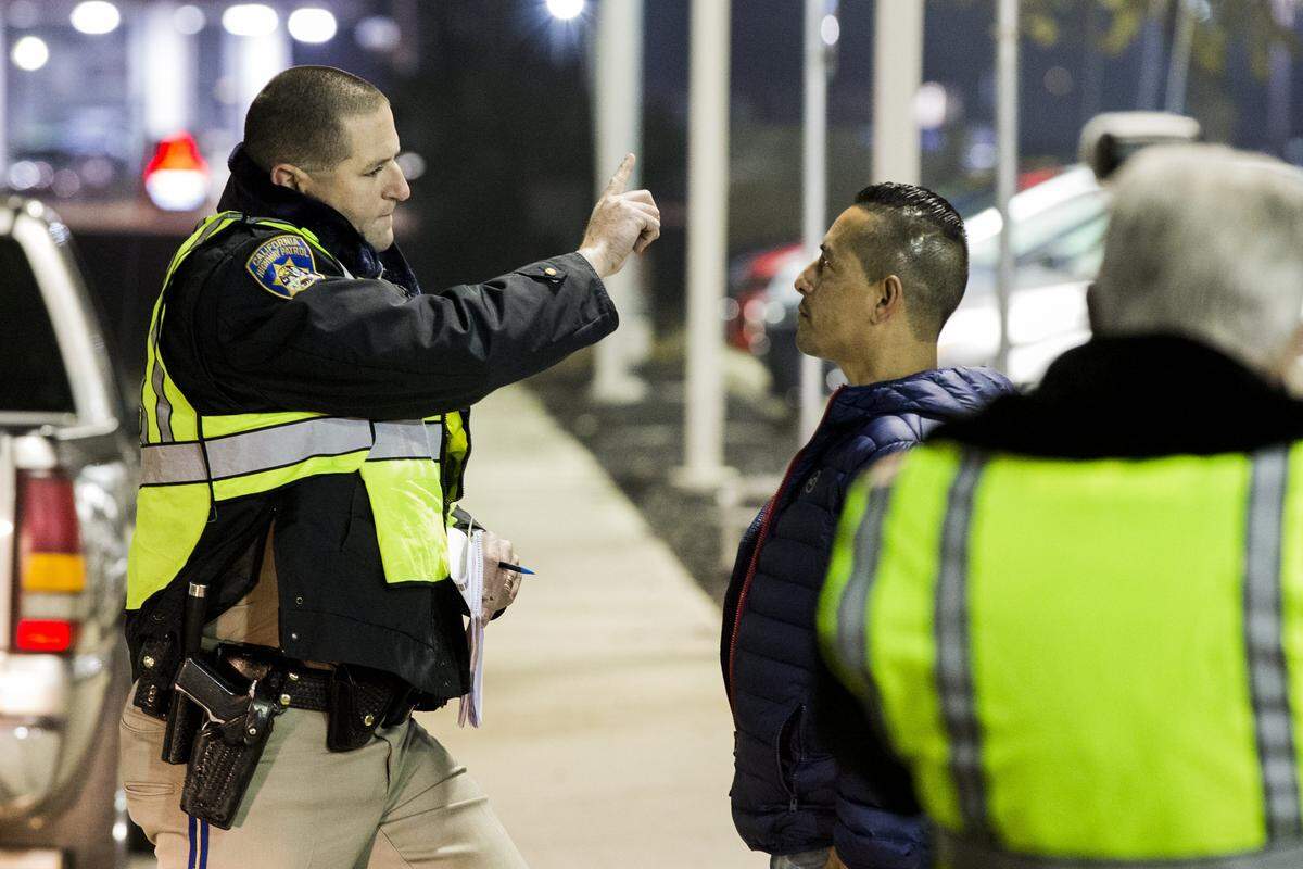 CHP Officer Leon gives a field sobriety test to a driver that he suspects to be under the influence during a DUI checkpoint in north Modesto. California Highway Patrol spent Friday Dec. 29, 2017 night checking over two hundred vehicles that passed through their DUI checkpoint in north Modesto, CA. One arrest was made for a DUI as of 1am according to officers at the checkpoint.