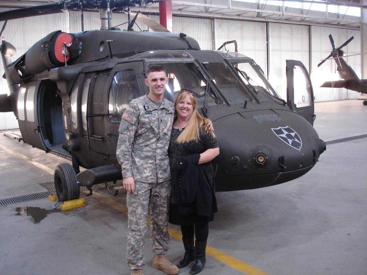 Shane Barnes and his mother, Kelly, are seen in 2015 at Fort Rucker, Ala., where Barnes attended flight school before deploying to South Korea as a Black Hawk helicopter pilot. Barnes was among five killed in a crash during a training exercise over the Mediterranean Sea on Friday, Nov. 10, 2023.