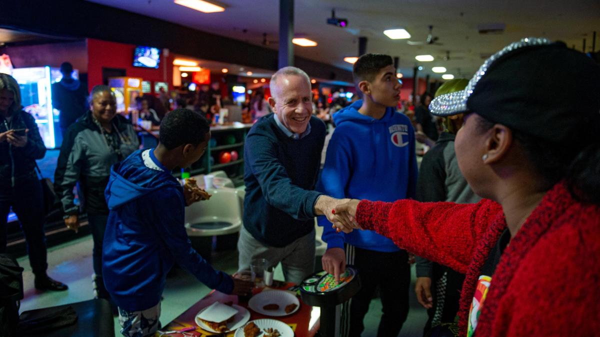 Sacramento Mayor Darrell Steinberg shakes hands with Annette Lopez of Sacramento during a community pop-up Friday, Dec. 27, 2019 put on by 21 Reasons in collaboration with the City of Sacramento as a way to provide positive activities for Sacramento youth.