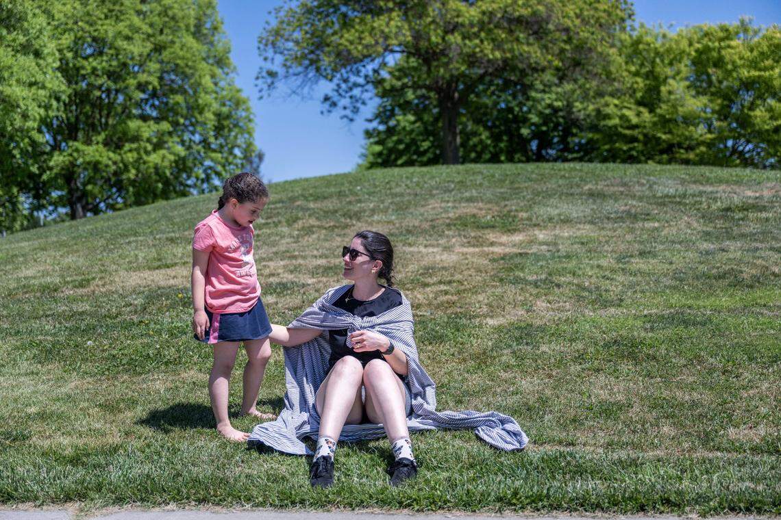 Helena Menezes, 5, and her mother Flavia Menezes enjoy Community Park in Davis last month.