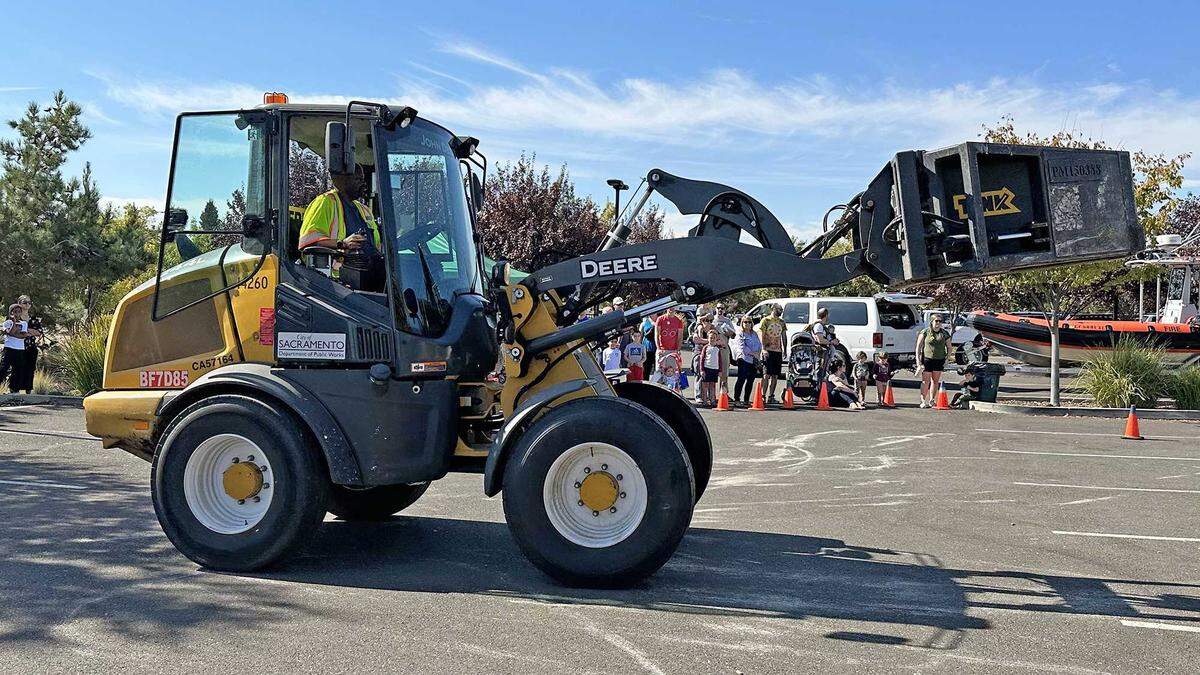 The Claw, a front-loading tractor fitted with an articulating bucket for picking up loose debris, is demonstrated to the public at North Natomas Regional Park on Saturday, Oct. 21, 2023. The implement, operated by the city of Sacramento’s Public Works Department, is deployed during the fall and winter months to pick up leaf piles across the city.