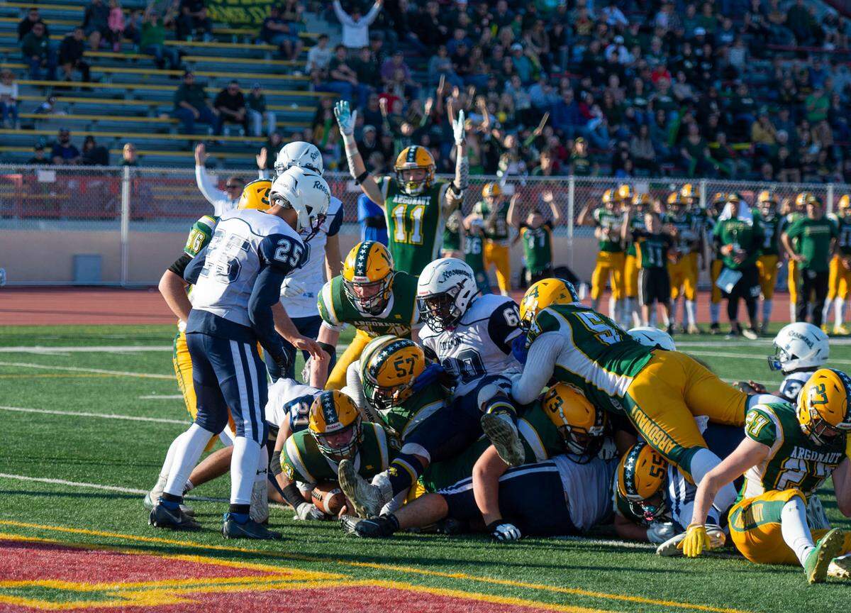 Argonaut Mustangs quarterback Beau Davis (23) scores on a 1-yard quarterback keeper against the Rosemont Wolverines during the third quarter of the CIF Sac-Joaquin Section Division VI championship game on Saturday, Nov. 27, 2021, at Hughes Stadium in Sacramento. The Mustangs won 31-20.