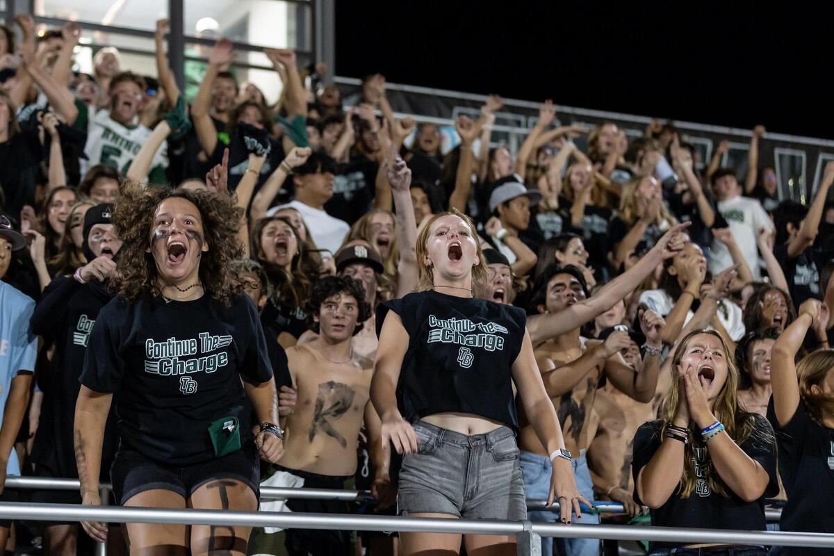 The Twelve Bridges’ crowd celebrates after the clock runs out in the school’s first varsity football game on Friday, Aug. 19, 2022, at Twelve Bridges High School in Lincoln. The Raging Rhinos defeated the McClatchy Lions 36-35.
