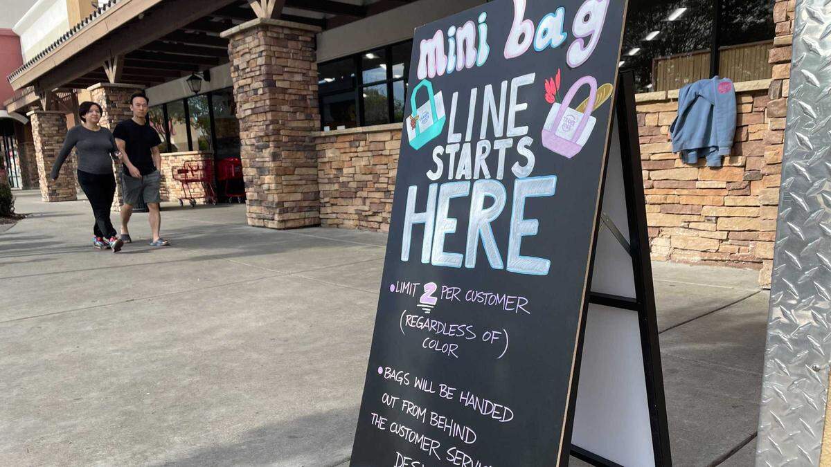A sign posted in front of the Trader Joe’s in Elk Grove heralds miniature tote bags that went on sale for $2.99 each. Lines for the bag were seen on Tuesday in Elk Grove and Thursday morning in Arden Arcade.