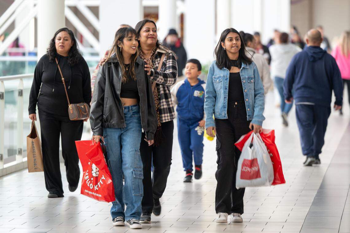 Anshu Lata, center, of Stockton shops with her daughters, Taanvi Trishika, second from left, and Rhea Lal, right, during Black Friday shopping weekend at Arden Fair mall on Sunday, Dec. 1, 2024. Sacramento store Strapping is among the top 50 spots to buy a gift in the United States during the 2024 holiday season, according to Yelp Elites.