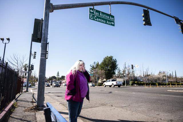 Lisa Wiley gets emotional in February while standing at the intersection where her son, Robert Jenson, was killed in by a hit-and-run driver in 2022.