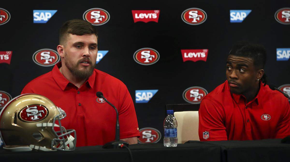 Center Weston Richburg, left, and running back Jerick McKinnon speak during a 49ers media conference March 15 in Santa Clara. They were both placed on the physically unable to perform list Friday.