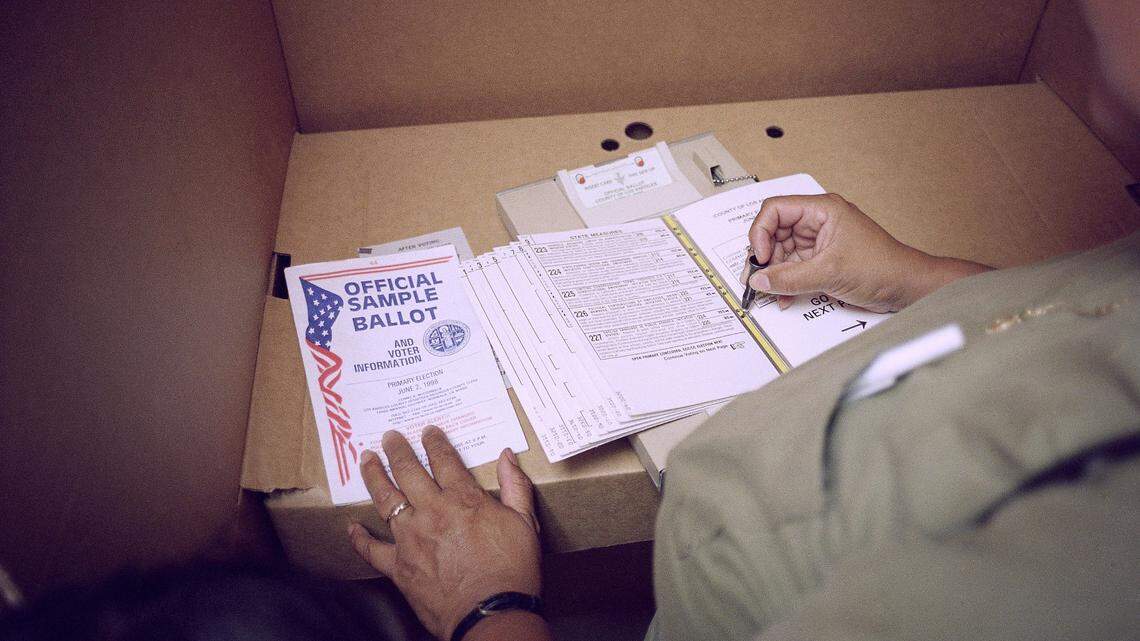 An unidentified voter casts her vote against Proposition 227, the proposition to end bilingual education, at the Aliso Village polling place in East Los Angeles, Tuesday, June 2, 1998. Voters throughout California cast ballots Tuesday, in Tuesday?s primary election. (AP Photo/Damian Dovarganes)