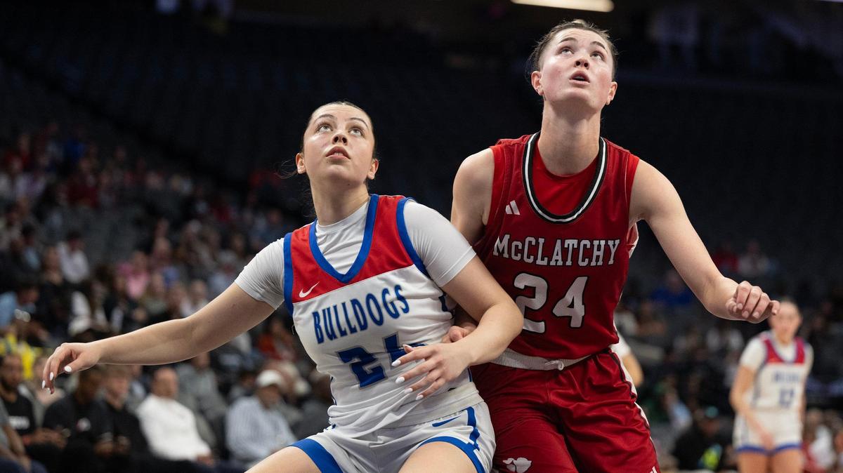 The Folsom Bulldogs’ AnnaBell Dotson (21) and the McClatchy Lions’ Daisy Throckmorton (24) position for a rebound in the first half in the Sac-Joaquin Section Division I girls basketball championship game on Friday, Feb. 28, 2025 at Golden 1 Center.