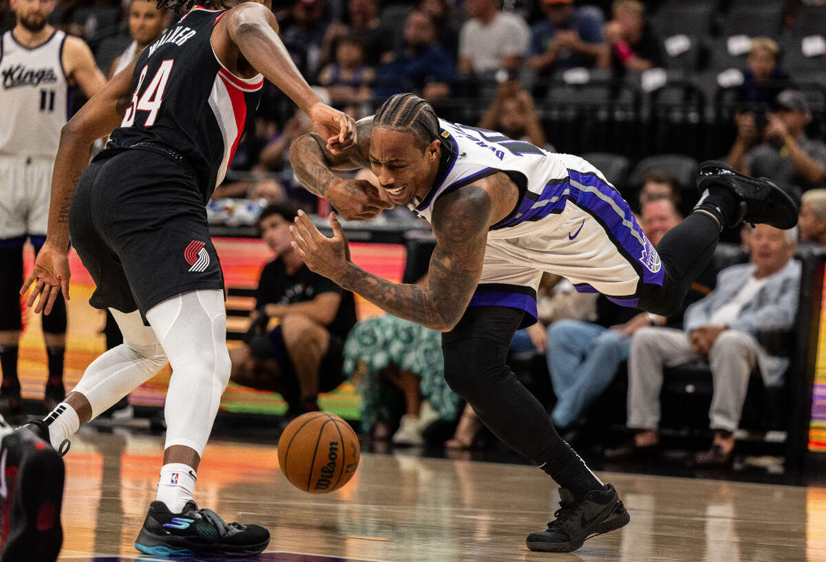 Portland Trail Blazers forward Jabari Walker (34) steals the ball from Sacramento Kings forward DeMar DeRozan (10) during a preseason NBA game on Sunday at Golden 1 Center.