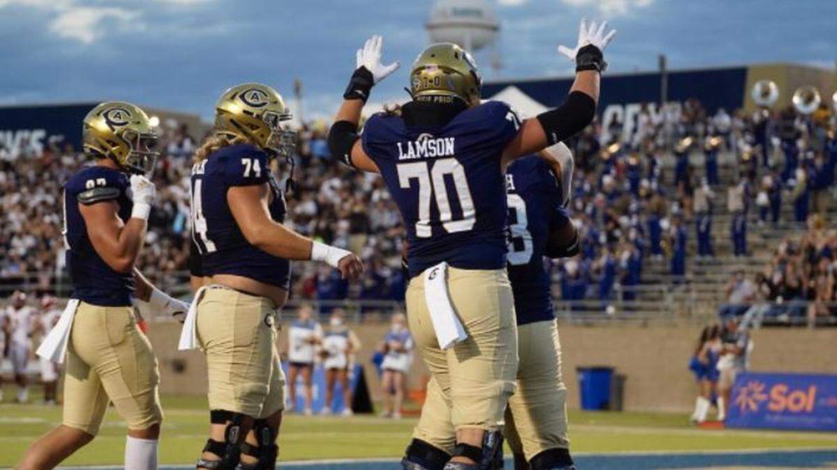 UC Davis offensive linemen celebrate during a win over Dixie State on Saturday, Sept. 18, 2021.