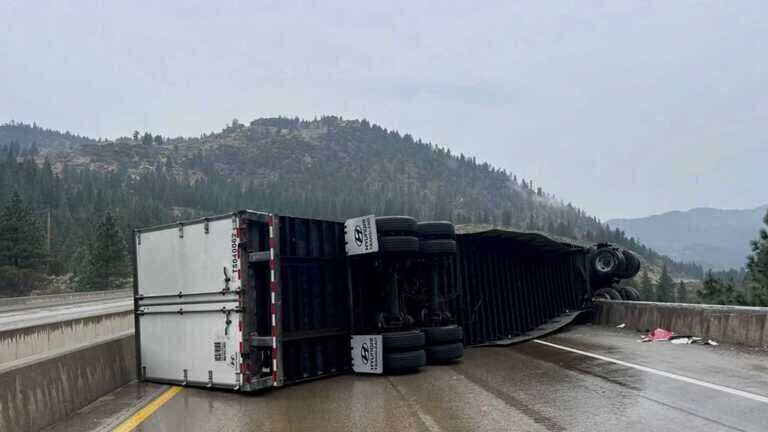Semitruck overturns, dangles over I-80 near Truckee, shutting lanes