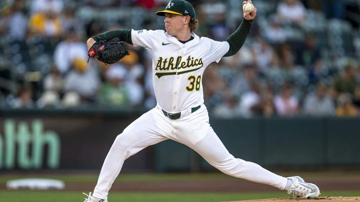 Athletics starting pitcher JP Sears (38) throws a pitch to Seattle Mariners outfielder Julio Rodríguez in the first inning during a baseball game at Sutter Health Park in West Sacramento on Monday.