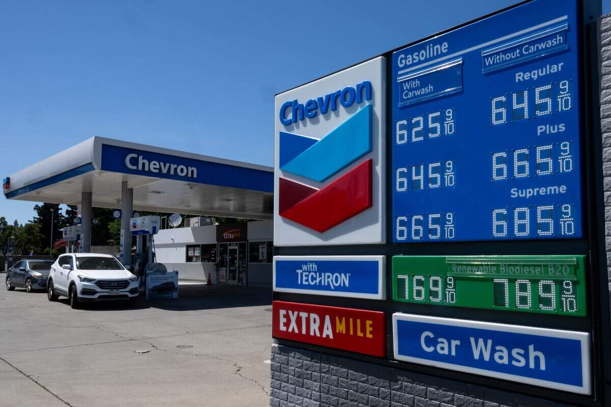 Customers purchase fuel at a Chevron gas station at Folsom Boulevard and Howe Avenue in Sacramento.