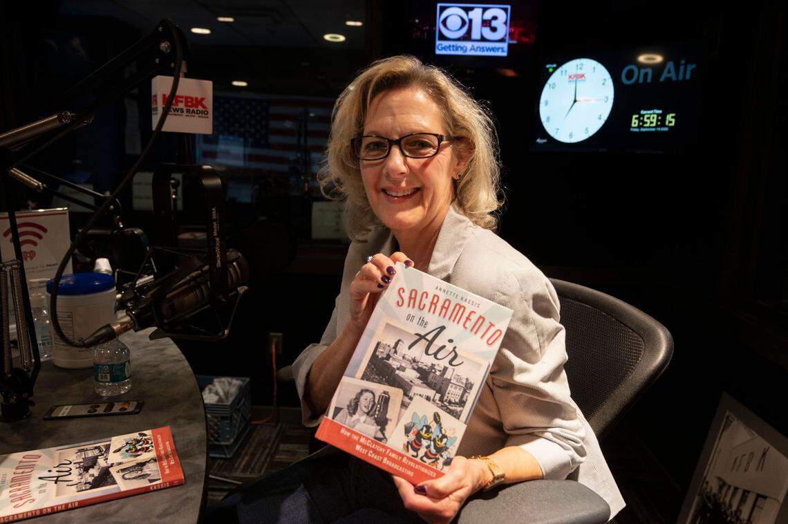Annette Kassis, author of “Sacramento on the Air,” shows her book while being interviewed for the 100th anniversary of KFBK on The Pat Walsh show Friday, Sept. 16, 2022.