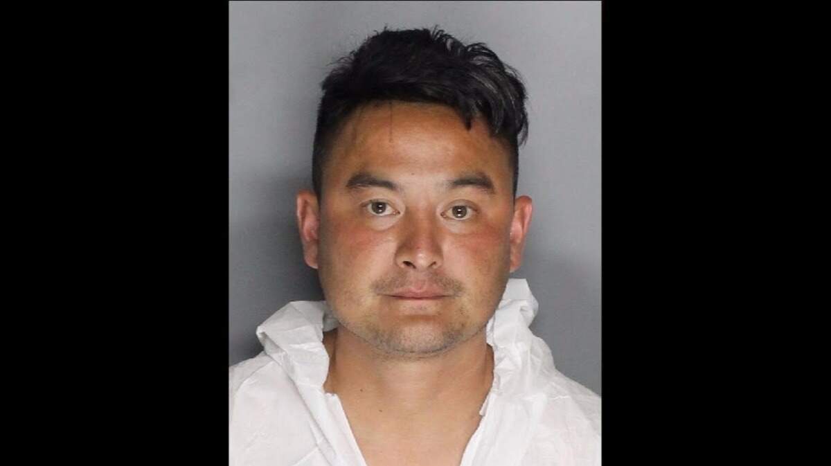 Kennedy Nguyen, 38, was arrested for charges including felon in possession of a firearm, assault with a deadly firearm and possession of an unregistered assault weapon following an eight-hour standoff with SWAT at a South Sacramento motel Friday morning.