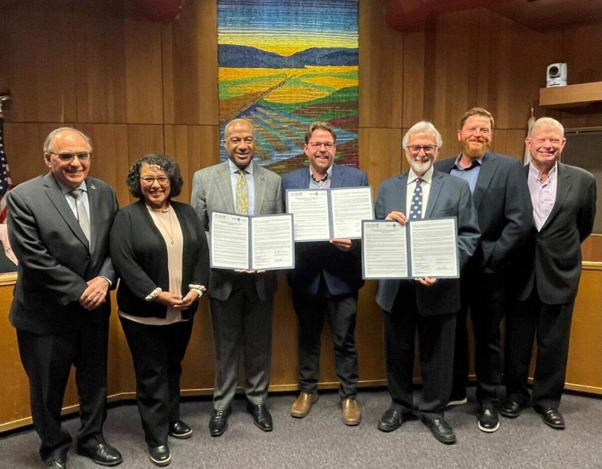 Yolo County Supervisor Jim Provenza, Davis City Council Member Gloria Partida, UC Davis Chancellor Gary May, Davis Mayor Lucas Frerichs, Yolo County Supervisor Don Saylor, Davis City Council Member Josh Chapman and Davis City Council Member Dan Carson, left to right, signed a joint resolution “declaring our community Hate-Free Together.”