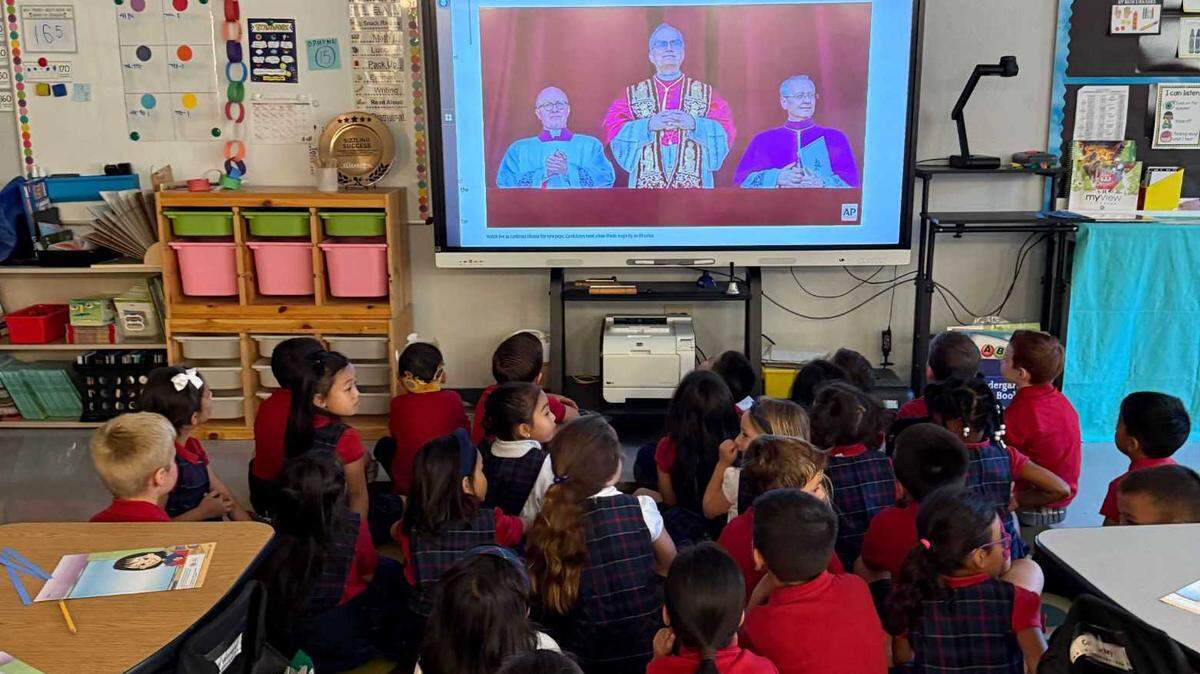 Kindergartners at St. Elizabeth Ann Seton Catholic School in Elk Grove watch the first public appearance of Pope Leo XIV on Thursday, May 8, 2025. For many pupils at the K-8 parochial school, it was their first time witnessing the selection of a new pope — this time, an American.