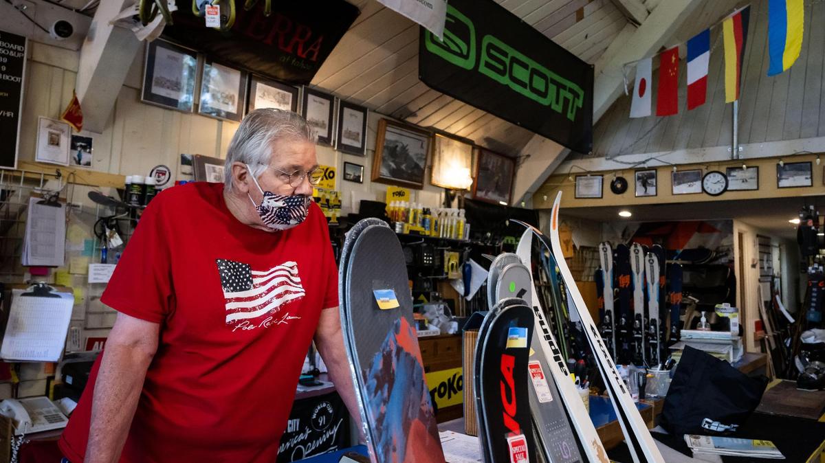 Bill Proffit, owner of longtime Sacramento establishment Land Park Ski & Sports, stands behind a selection of skis Tuesday, Aug. 9, 2022, that were made in Ukraine, a key manufacturer in the ski industry. The business is one of many ski retailers impacted by the war in Ukraine after Russia’s invasion earlier this year.