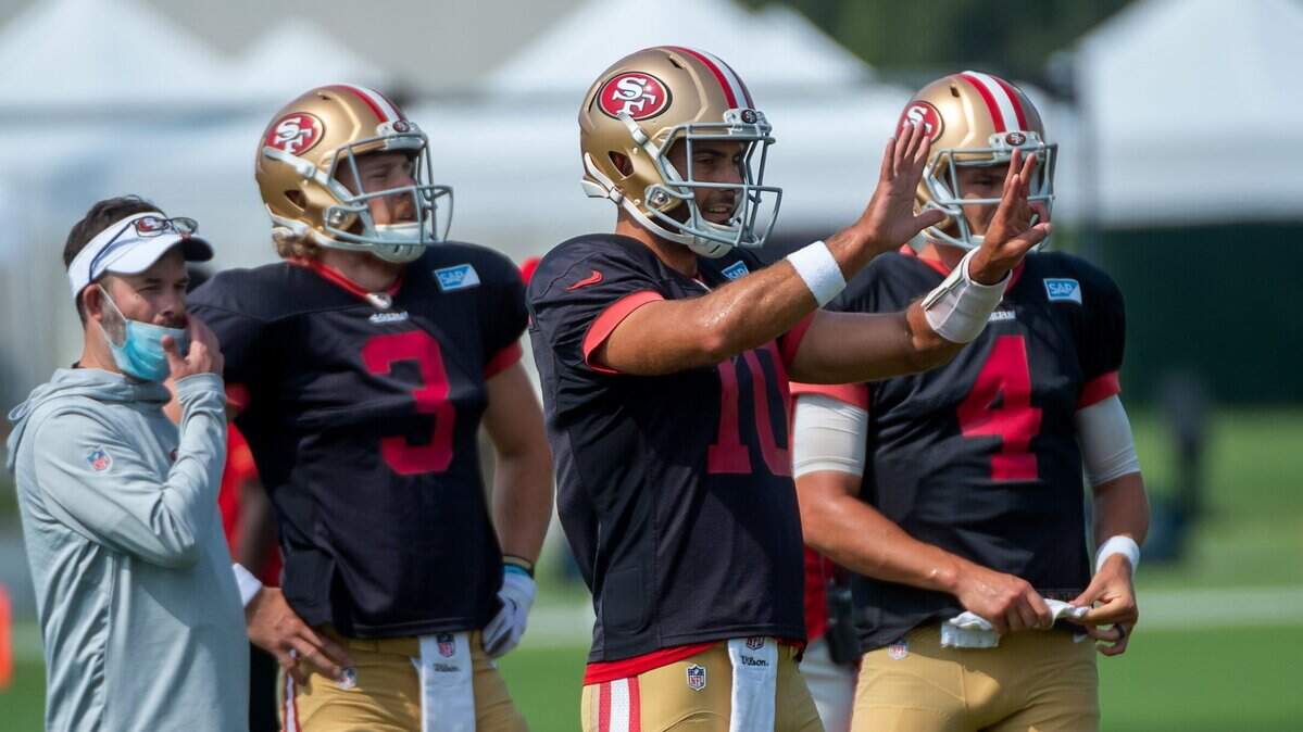 San Francisco 49ers quarterback Jimmy Garoppolo (10) gives directions with fellow QBs C.J. Beathard (3) and Nick Mullens (4) during training camp at Levi’s Stadium on Tuesday, Aug 25, 2020 in Santa Clara.