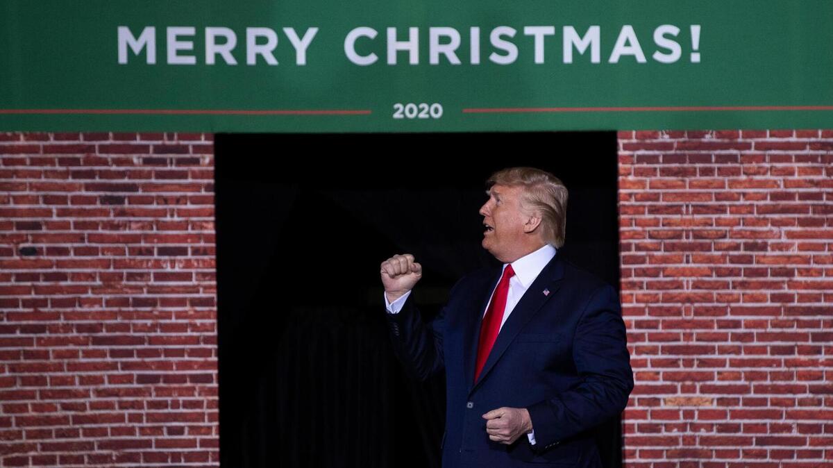 Then-President Donald Trump attends a campaign rally at Kellogg Arena in Battle Creek, Mich., in 2019, a few days before Christmas.