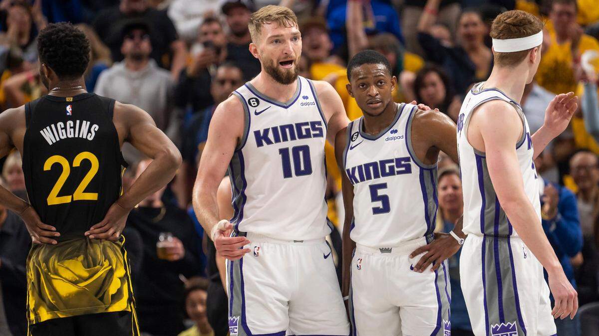 Sacramento Kings center Domantas Sabonis (10) and guard De’Aaron Fox (5) communicate during a break in play against the Golden State Warriors during the first half of Game 3 of the first-round NBA playoff series at Chase Center in San Francisco on Thursday, April 20, 2023.