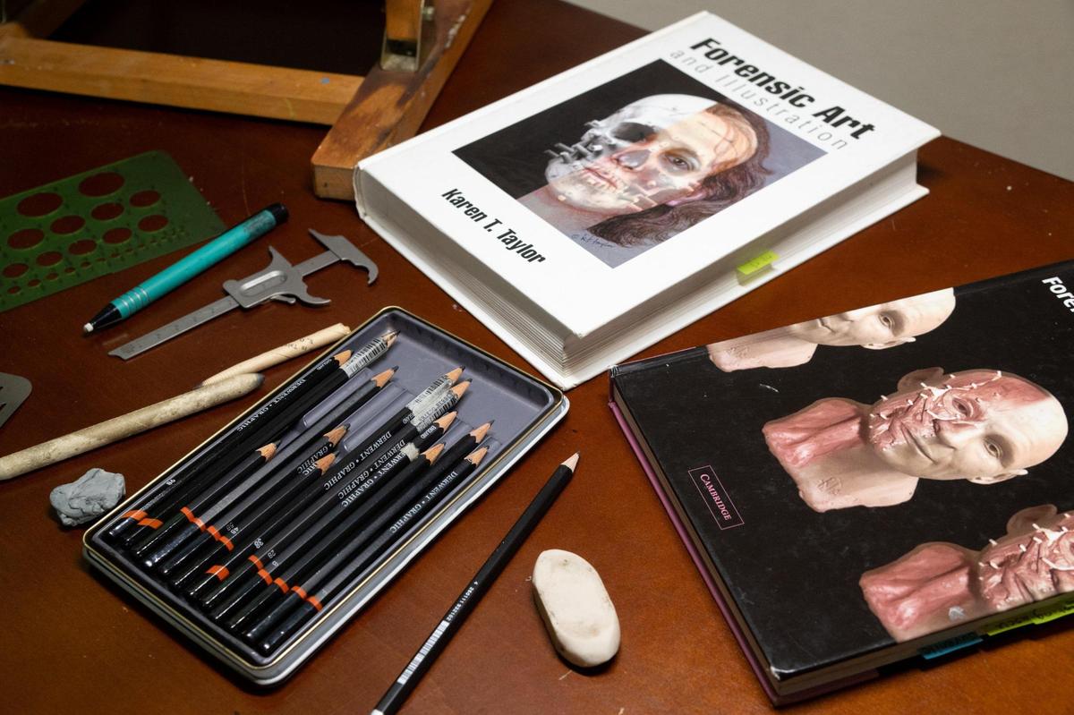 Forensic sketch artist Barbara Anderson uses pencil and paper to create a facial reconstruction sketch from an unidentified skull at her home in Rocklin on Wednesday, Aug. 3, 2022.