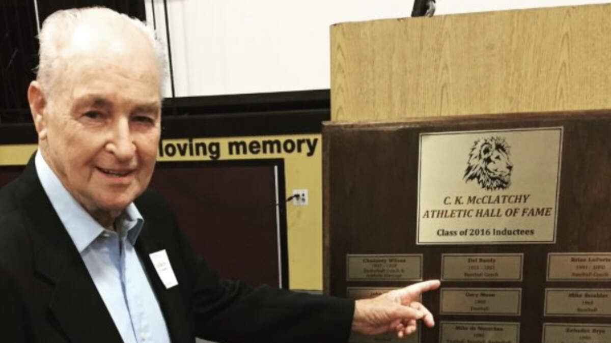 Del Bandy points to his name on a McClatchy High School plaque. He died in September at age 92.