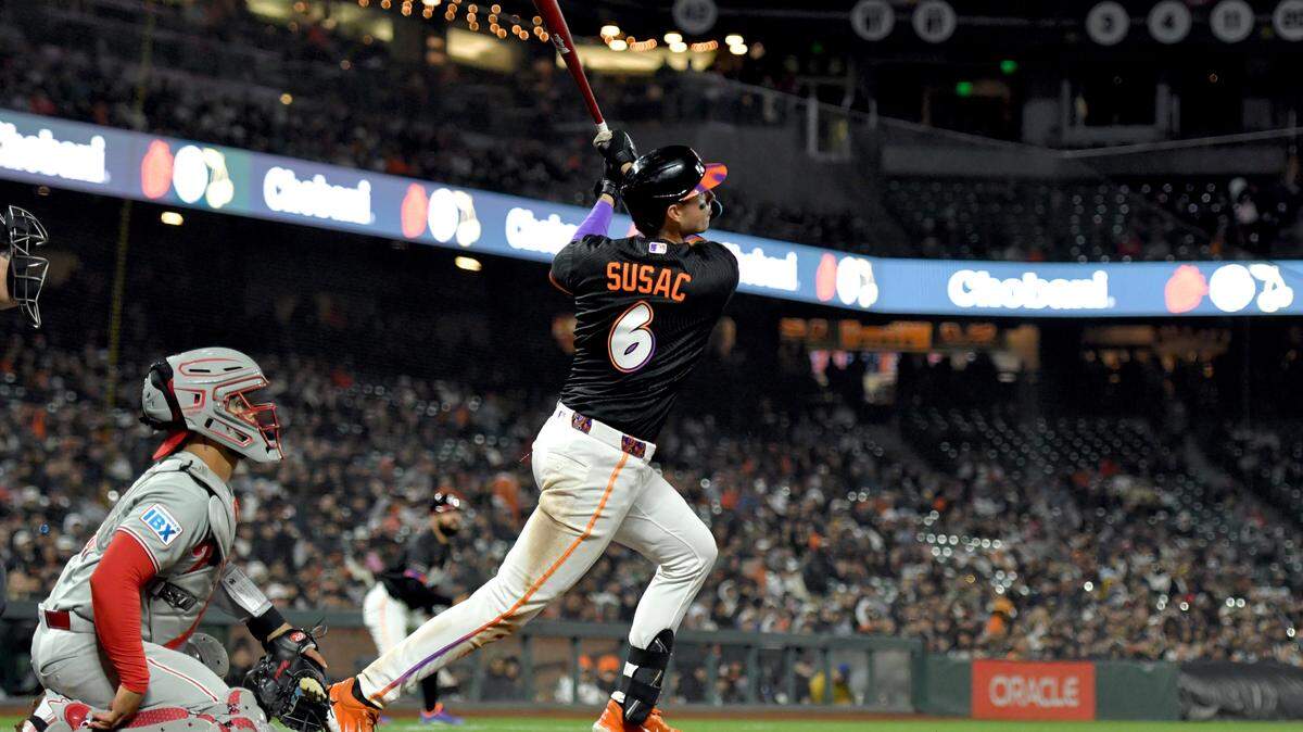 Daniel Susac of the San Francisco Giants hits a triple against the Philadelphia Phillies during the eighth inning at Oracle Park on April 7 in San Francisco.
