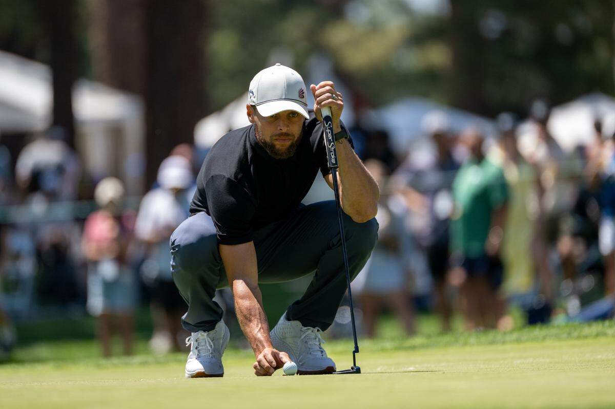 The Golden State Warriors’ Stephen Curry lines up a shot on the ninth hole during the American Century Championship celebrity golf tournament at Edgewood Tahoe Resort in Stateline, Nev., on Friday.